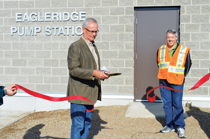 Cypress County outgoing reeve, Richard Oster cuts the ribbon to declare the new Eagleridge pump station in Dunmore and the $14.3-million Dunmore-Irvine-Walsh pipeline open on Friday afternoon. 