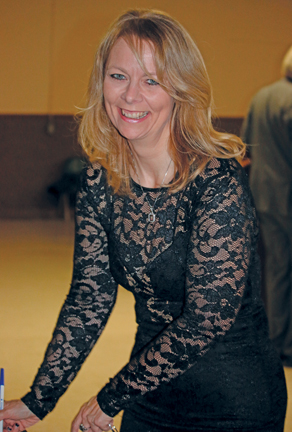 Corinna Roth-Beacome was all smiles as she placed a bid in the silent auction.
