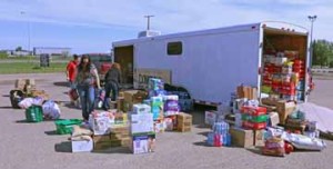 PHOTO BY JAMIE RIEGER- The people in southeast Alberta have shown overwhelming support for the Fort McMurray disaster relief effort. Pictured: Volunteers in Bow Island sort and load donated items into a trailer that will be loaded onto a Rosenau transport truck and shipped to Edmonton.
