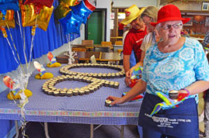 Photo by Tim Kalinowski- Caught red-handed. Merle Davies helped celebrate the Royal Canadian Legion's 90th anniversary with a specially decorated cupcake at the Redcliff Legion on Saturday.