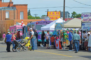 Photo by Tim Kalinowski- The streets in downtown Redcliff were filled with tents and kiosks offering food and merchandise for the many visitors to Redcliff Days.