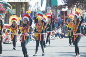 Photo by Tim Kalinowski Medicine Hat Fillipino community puts on colourful display during Stampede Parade.