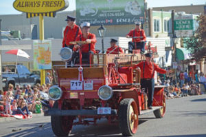 Photo by Tim Kalinowski Medicine Hat Vintage Car Club fire engine in Stampede Parade.