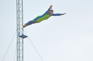 Photo by Tim Kalinowski High diver jumps from 100 feet up during the trick diving show at the Medicine Hat Exhibition and Stampede.