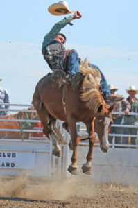 Photo by Jamie Rieger- Carson Stevenson lost his hat and didn't pick up any points with this ride in the bareback event.