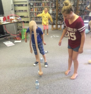 Photo submitted by Megan Kurtz- Cyndi Dalton (yellow hoodie), Morgan Unrau (red shirt), and Lincoln Kurtzweg take part in one of the fun games at the wind-up party.