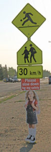 Photo by Jamie Rieger-A bright, clearly marked sign posted at the west end of the school zone by Senator Gershaw School reminds motorists to slow down.