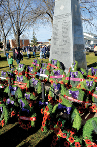 Photo by Tim Kalinowski Cenotaph and wreaths glow in the light of a beautiful sun at the Remembrance Day ceremony held in Redcliff on Friday.