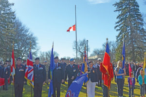 Photo by Tim Kalinowski Front and centre; Redcliff’s colour party led a 300 person parade into Legion Memorial Park on Friday. 